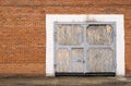 Gray large garage door made of bricks