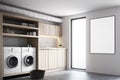 Gray laundry room interior, white washing machines