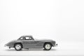 Gray little ancient model toy car isolated on background. Royalty Free Stock Photo