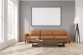 Gray living room with a beige sofa, poster, lamp Royalty Free Stock Photo
