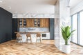 Gray and marble kitchen interior with bar Royalty Free Stock Photo