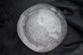Gray matte plate overhead on dark background. Premium empty tableware with dramatic contrast Royalty Free Stock Photo
