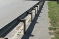 Gray metal barrier on the street Royalty Free Stock Photo