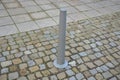 Gray metal bollards are used to protect pedestrians in the pedestrian zone or in the park on the promenade. gray pillars prevent p