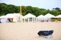 Gray metal garbage bin or can on beach Royalty Free Stock Photo