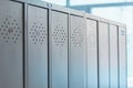 Gray metal outdated lockers in the empty school corridor of the old school Royalty Free Stock Photo