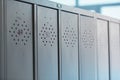 Gray metal outdated lockers in the empty school corridor of the old school Royalty Free Stock Photo