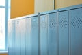 Gray metal outdated lockers in the empty school corridor of the old school Royalty Free Stock Photo