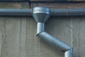 Gray metal pipes of a drain on a concrete wall Royalty Free Stock Photo