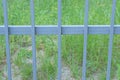 gray metal texture of iron rods on a background of green grass Royalty Free Stock Photo