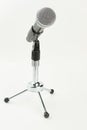 Gray microphone on short stand.