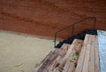 Gray monolithic concrete park bench made of concrete in the shape of round stones anthracite color park paths and interlocking pav Royalty Free Stock Photo