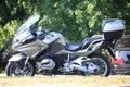 Gray motorcycle BMW R1200 RT on a sunny day. Left view, slight blur Royalty Free Stock Photo