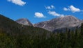 A gray mountain in Colorado against a bright blue sky