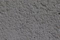 Gray natural texture with small stones. Roughened gravel surface. Royalty Free Stock Photo