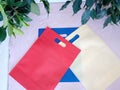 Colorful Non Woven Bags Isolated on table. Eco Bags with leaves. Tote bag gift for you Royalty Free Stock Photo