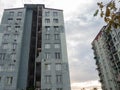 Gray old panel house. Nine-story building. Old architecture