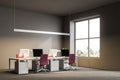 Gray open plan office workplace, business centre