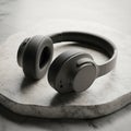 Gray Over-Ear Headphones on Marble Surface Royalty Free Stock Photo
