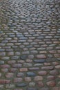 Gray pattern of granite medieval paved road. Vertical background texture