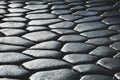 Gray pave stones in dark and light lighting