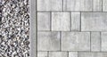 Gray pavement with gravel texture. Gravel road garden. Paving pattern road. Brick stone surface Royalty Free Stock Photo