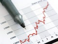 Gray pen on white growing share price chart Royalty Free Stock Photo