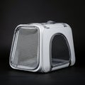 Gray pet carrier with mesh windows on a dark background. Rectangular shape with Royalty Free Stock Photo