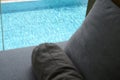 grey pillow put on bed, pool view Royalty Free Stock Photo