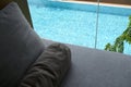 grey pillow put on bed, pool view Royalty Free Stock Photo