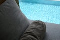 grey pillow put on bed, pool view Royalty Free Stock Photo
