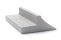 Gray plaster ramp with two sides for fingerboarding, isolated on a white background