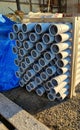 Plastic pipes gray diameter 15-25cm for sewers and construction. Pipes warehouse in a shipping container, building materials Royalty Free Stock Photo