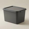 A gray plastic storage container with a secure, fitted lid. The box has a simple design