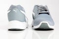 Gray Puma sports running shoes isolated on white background. Royalty Free Stock Photo