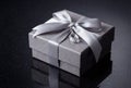 Elegant Gray Gift Box with Silver Ribbon and Crystal Charm Royalty Free Stock Photo