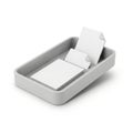 Gray rectangular tray containing a stack of blank, square white papers with peeled Royalty Free Stock Photo