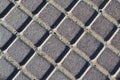 Gray rhombus background. Geometric pattern on the metal cover of the sewer manhole Royalty Free Stock Photo