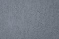 Gray ribbed wall surface of plaster. Abstract grey pattern, dark rough architecture background. Grunge stucco texture. Corrugated