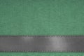 Gray ribbon on green fabric background with copy space.