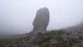 Rock peak in fog