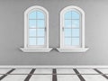 Gray room with two arched windows Royalty Free Stock Photo