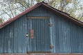 gray rural wooden attic with a closed door Royalty Free Stock Photo