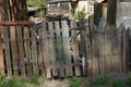 Gray rural wooden fence with a closed door Royalty Free Stock Photo