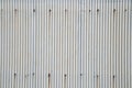 Gray rusty wavy metal plate wall background