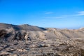 Gray sand dunes with the grass grown through the sandy surface Royalty Free Stock Photo