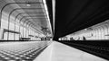 Gray scale shot of the interior of a subway station