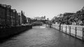 Gray-scale shot of the river with building on the side in Hamburg, Germany