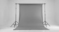 Gray seamless paper backdrop on stand in studio setting Royalty Free Stock Photo
