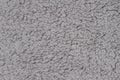 Gray sherpa textured plush fabric material background